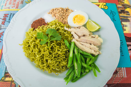 Spicy  noodle vegetable salad on white plateの写真素材