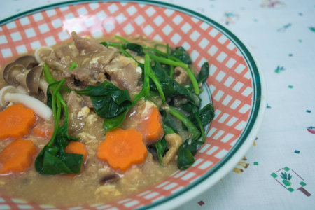 Fried noodle with pork and broccoli on backgroundの写真素材