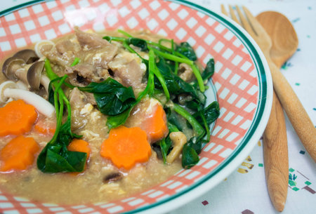 Fried noodle with pork and broccoli on backgroundの写真素材