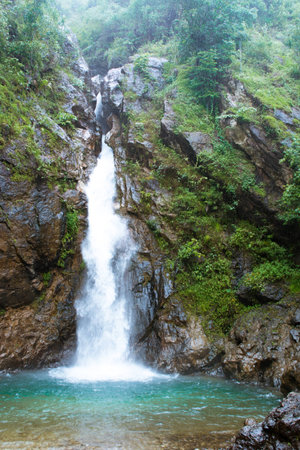 Tropical waterfall in forestの写真素材