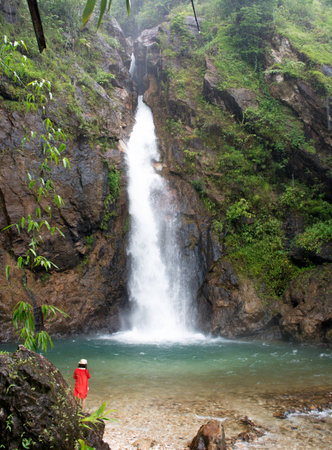 tourist at Tropical waterfall in Thailandの写真素材