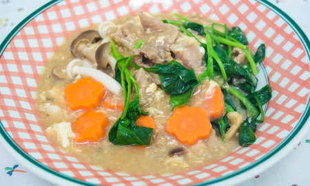 Fried noodle with pork and broccoli on backgroundの写真素材