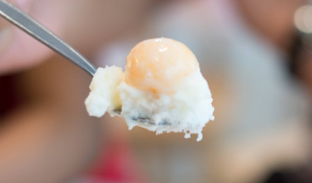 Bingsu ice dessert with cantaloupe on the spoonの写真素材
