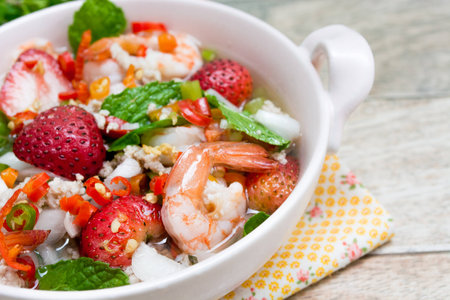 Strawberry salad with fresh berries on wood backgroundの写真素材