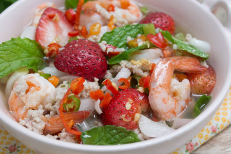 Strawberry salad with fresh berries on wood backgroundの写真素材