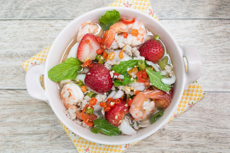 Strawberry salad with fresh berries on wood backgroundの写真素材