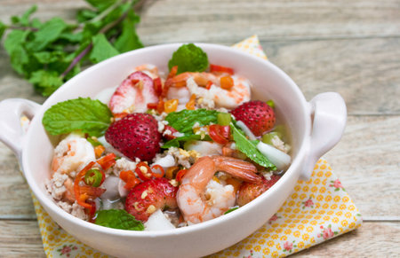 Strawberry salad with fresh berries on wood backgroundの写真素材