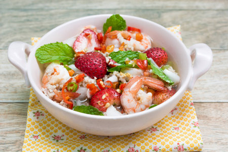 Strawberry salad with fresh berries on wood backgroundの写真素材