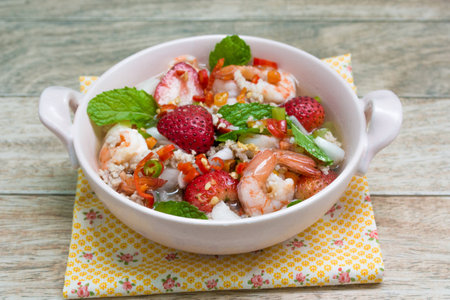 Strawberry salad with fresh berries on wood backgroundの写真素材