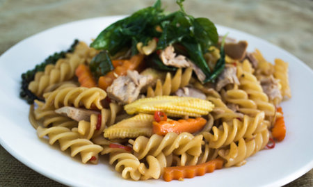 spicy spaghetti sauce and basil on backgroundの写真素材