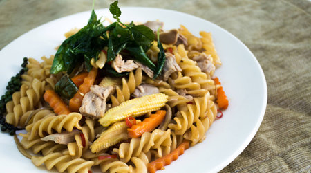 spicy spaghetti sauce and basil on backgroundの写真素材