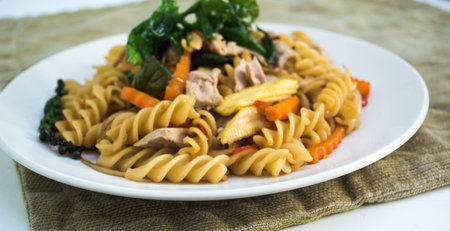 spicy spaghetti sauce and basil on backgroundの写真素材