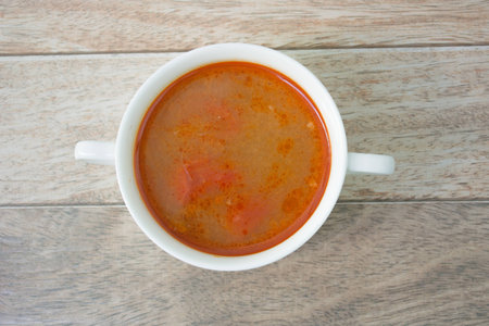 tomyum soup on wood backgroundの写真素材