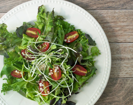 Fresh salad on wood backgroundの写真素材