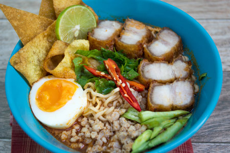 Spicy tomyum noodle  on wood backgroundの写真素材