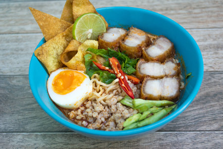 Spicy tomyum noodle  on wood backgroundの写真素材