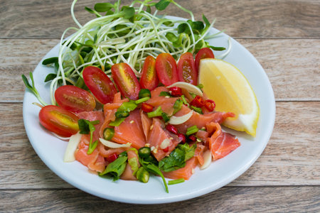 Salmon salad on wood backgroundの写真素材