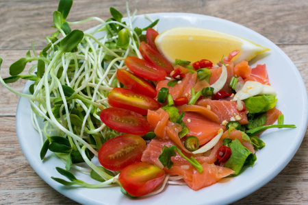 Salmon salad on wood backgroundの写真素材