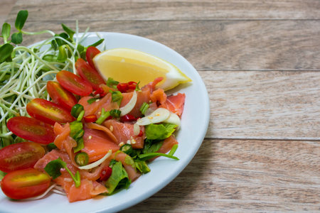 Salmon salad on wood backgroundの写真素材