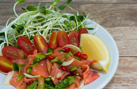 Salmon salad on wood backgroundの写真素材