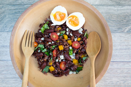 Riceberry with grain and egg  on wood backgroundの写真素材