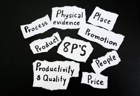 hand writing 8p strategy on paper with black background