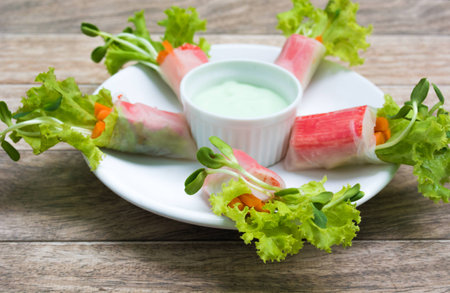 sushi roll on white dish with wood backgroundの写真素材