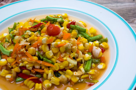 Thai fruit spicy alad on white dishの写真素材