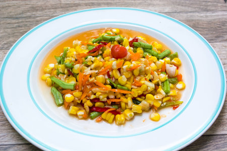 Thai fruit spicy alad on white dishの写真素材