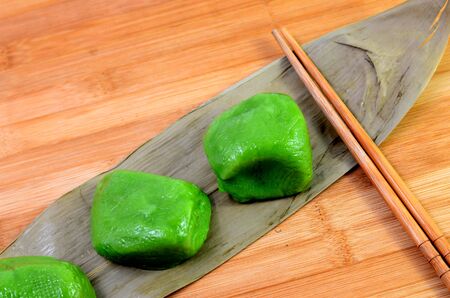 Qingming festival traditional cuisine - Green dumplings on bamboo leafの写真素材