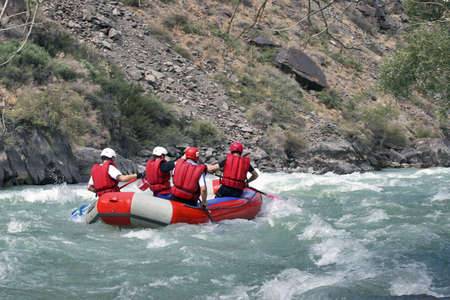 4 athletes in the boat for raftingの写真素材