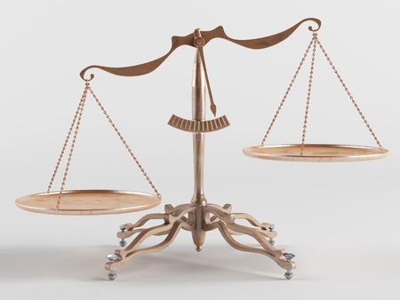 Old brass scales are tilted in one directionの写真素材