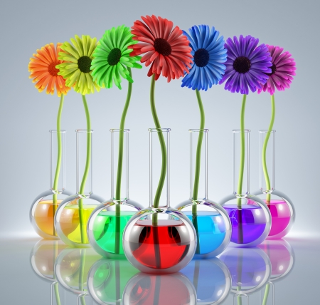  Flowers in laboratory flasks with liquids of different colorsの写真素材