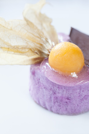 Close-up picture of a dessert with chocolate and fruit decorationの写真素材