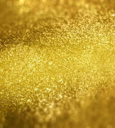 Picture of a golden background with sparkling glitterの写真素材