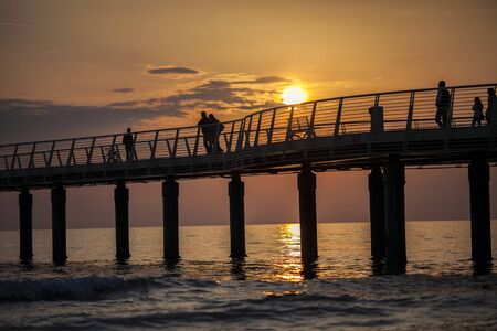 View of a Versilia sunset. Sea and tourists.の写真素材