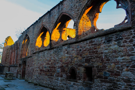 Sunset glow through the ruins of Beauly Priory In Scotland.の写真素材