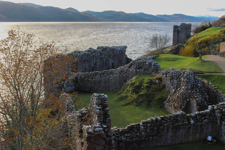 Birds eye view of the ruins of Urquhart Castle and Loch Ness in the Autumn.のeditorial素材