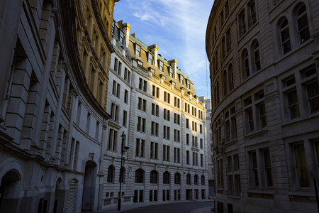 Sunset on Incredible curved architecture in London England.の写真素材