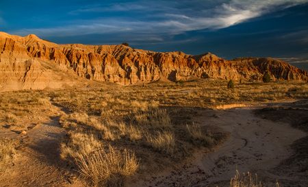 Dramatic desert landscape of Cathedral Gorge State Park at sunset in Nevada, USA.の写真素材