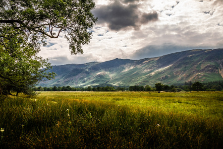 Beautiful and serene landscape of a cloudy day in the Lake District in Cumbria, England UK.の写真素材
