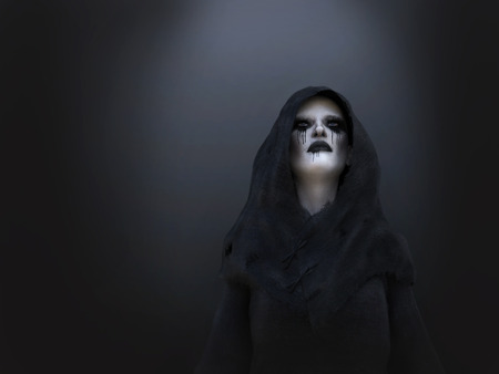 3D rendering of a female death angel or demon wearing a black hood. Dark background.の写真素材