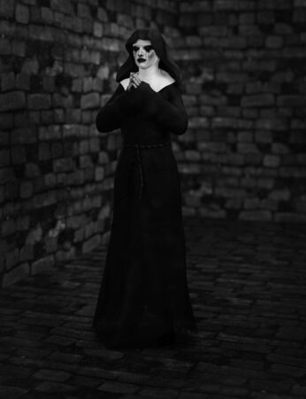 A ghost nun with smoke in the dark mysteriousの写真素材