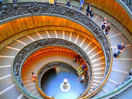 VATICAN CITY - OCTOBER 12, 2015: Tourists walking down the spiral staircase (Bramante Staircase) in the Vatican Museumsのeditorial素材
