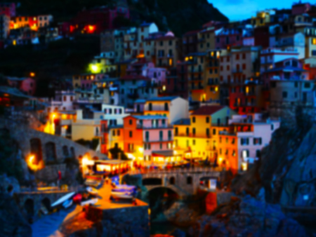 Blurry colorful night view of Manarola in Italyの写真素材
