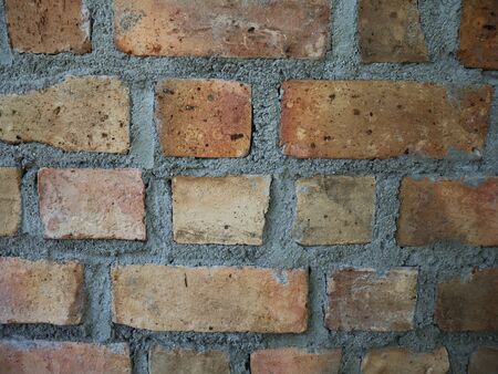 Closeup dark natural brick wall texture background