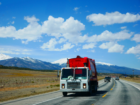 COLORADO/USA - APRIL 13, 2017: Colorful truck and car on a beautiful countryside road in Glenwoodのeditorial素材
