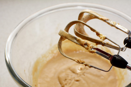 Hand mixer beaters mixing a smooth cookie dough batter