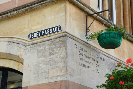 Winchester, UK - June 13, 2014  Distances from Winchester to London, Southampton, Portsmouth and Salisbury are shown on the wall at Abbey Passage in Winchester, Englandのeditorial素材