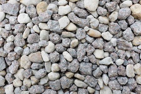 Grey and white crushed granite rock as an abstract texture background